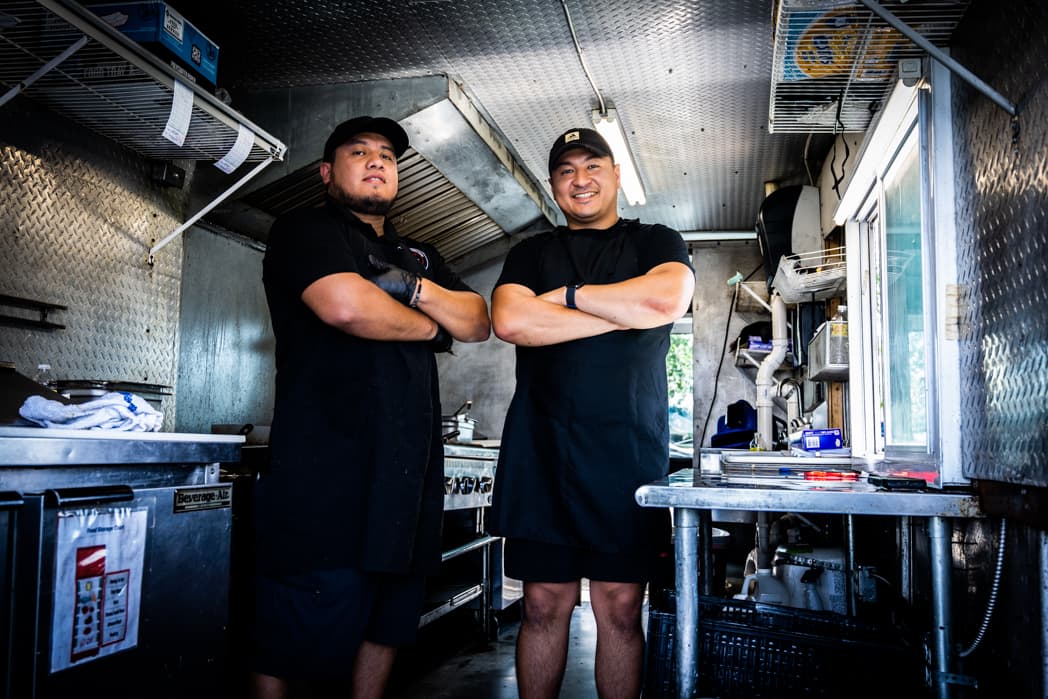 Two food truck operators posing with arms crossed inside their kitchen — Cincinnati event photographer K Dalton